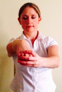 Hold the fist and gently pull back until a comfortable stretch is achieved.